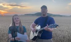 Greg Peterson and wife BrookeAnna sing amid the wheat field