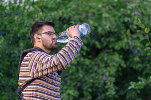 farmer-drinking-water-orchard